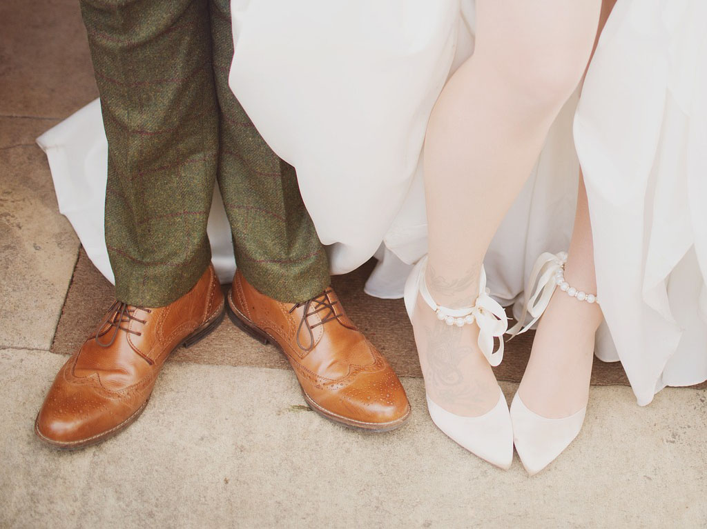 Bride and groom legs /showing garter belt.