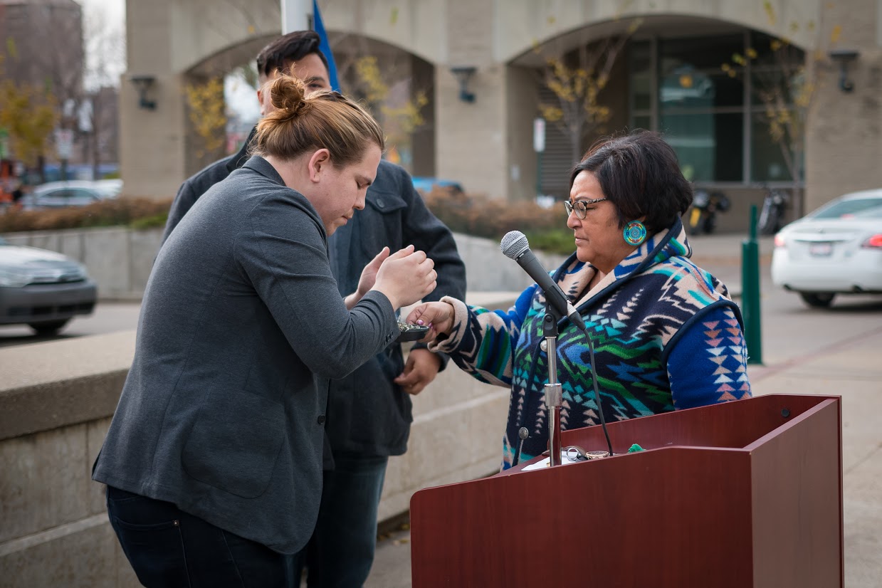 Roxanne Tootoosis, Indigenous Knowledge Keeper and Facilitator, performing a smudging at MacEwan University in 2017.