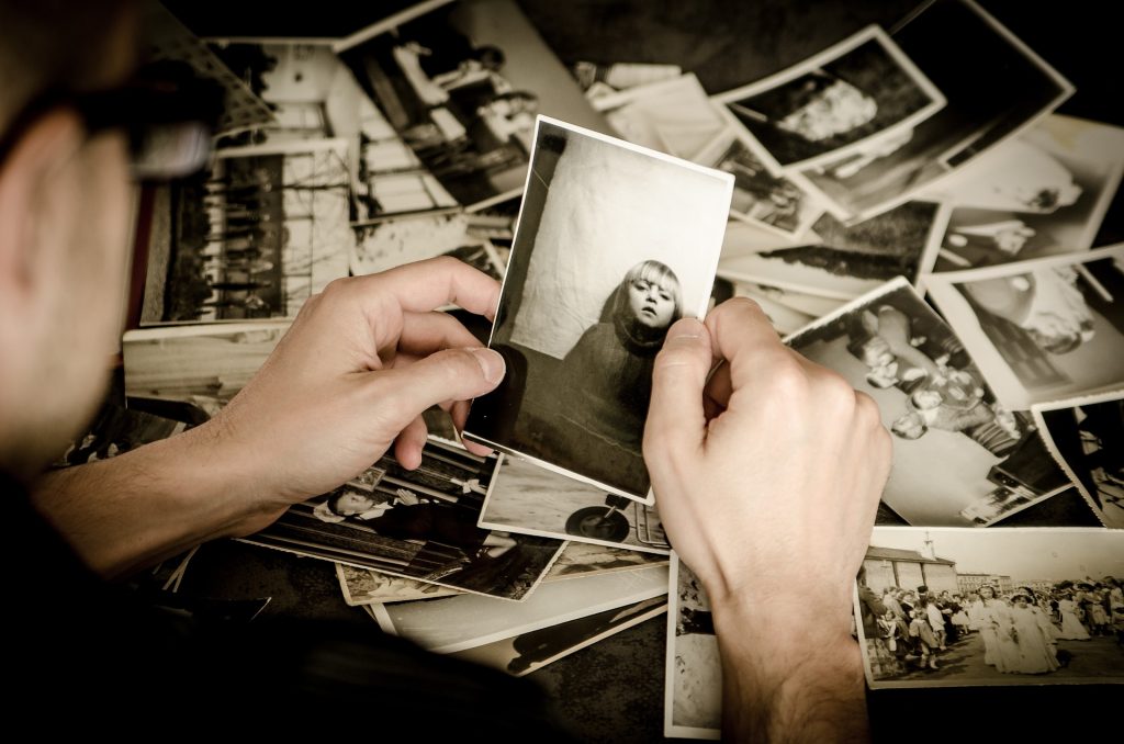 Photographs and hands.