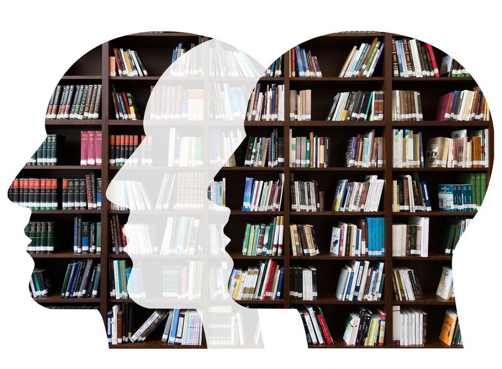 Three head silhouettes with library journals and books in them.