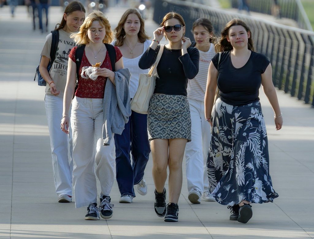 A group of girls casually walking.