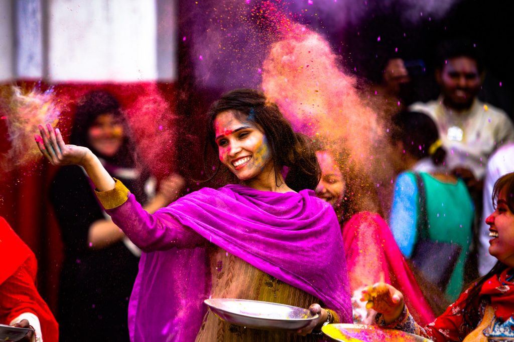 A group of people celebrating Holi.